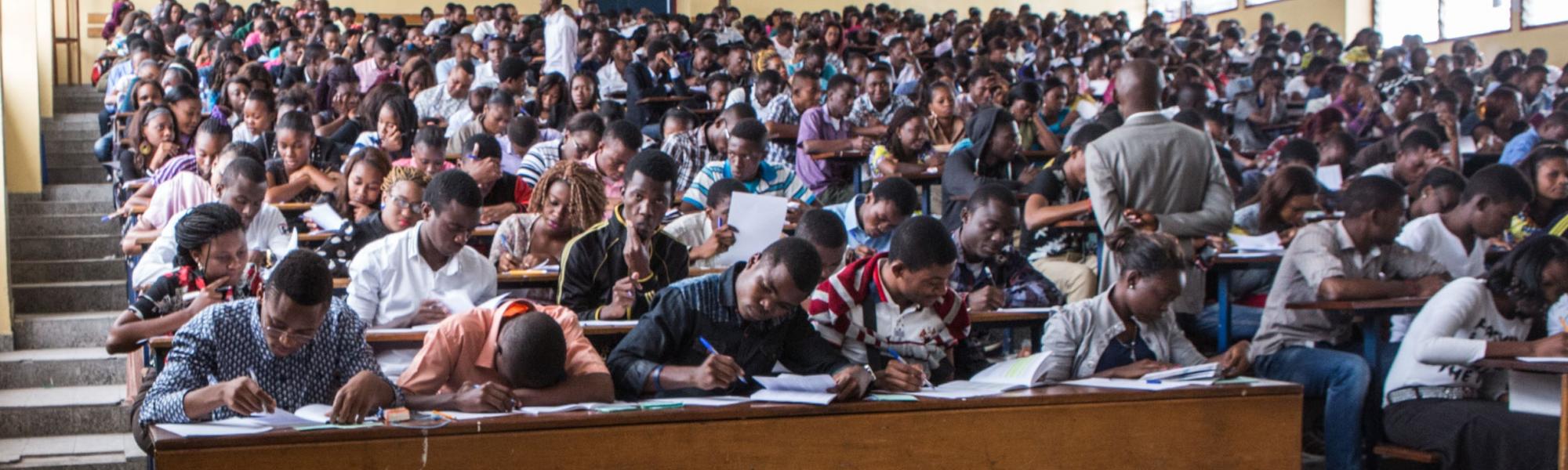 Students taking notes during class at Université Protestante au Congo